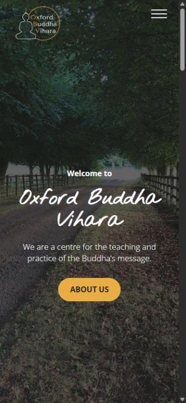 Oxford Buddha Vihara mobile homepage with the monastery logo, menu and introduction over a tree-lined path